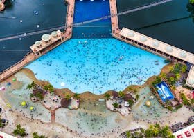 Aerial shot showing a vibrant resort pool in Subang Jaya, offering a tropical escape.